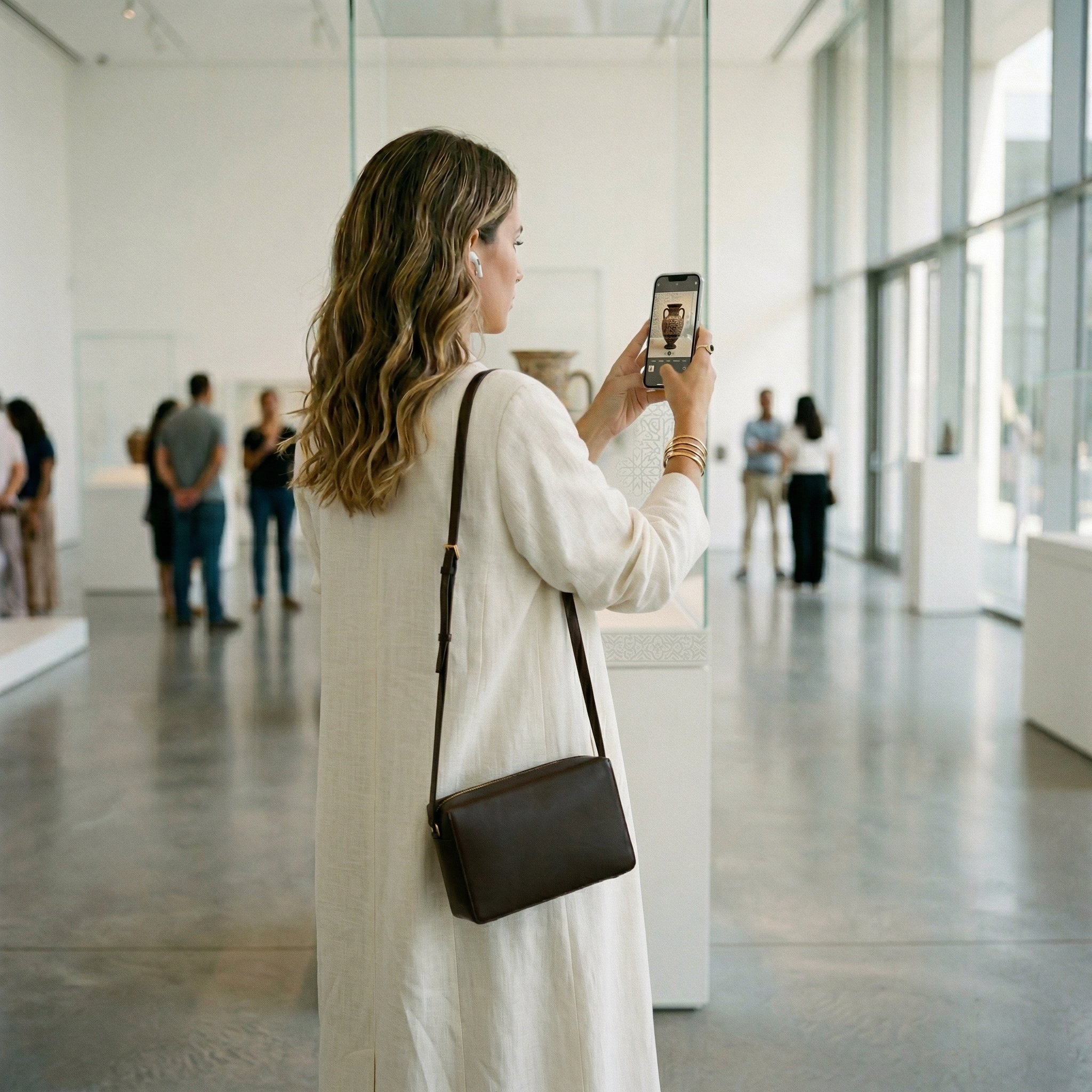 Museum visitor using smartphone